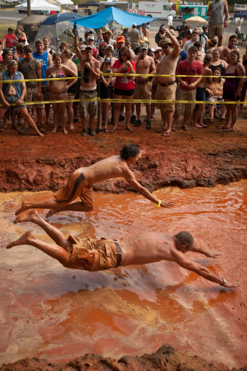 Mud-Pit Belly Flopping | Alamy Stock Photo