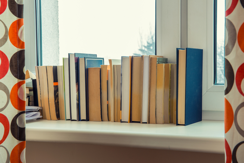 Unread Books | Shutterstock Photo by badahos