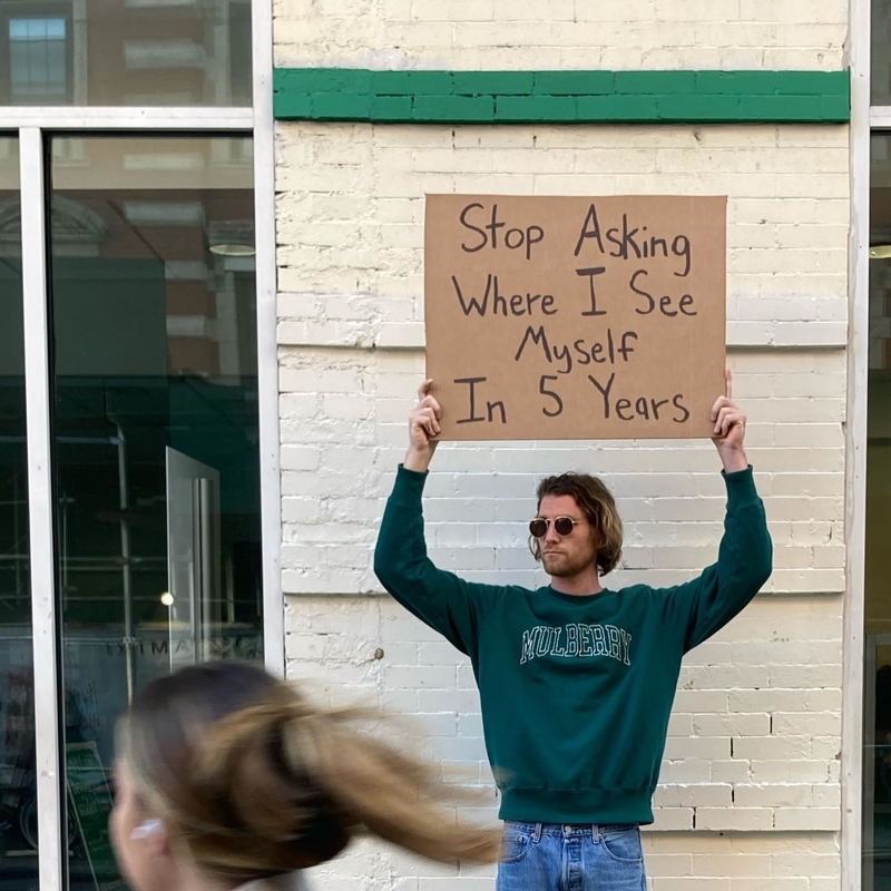 Probably on a Street Corner, Holding a Sign | Instagram/@dudewithsign