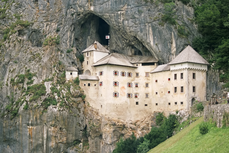 Slovenia Has a Castle Built Into a Cliff Cave | Getty Images Photo by efenzi