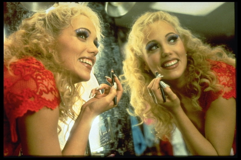 1995: Showgirls | Getty Images Photo by Murray Close/Sygma