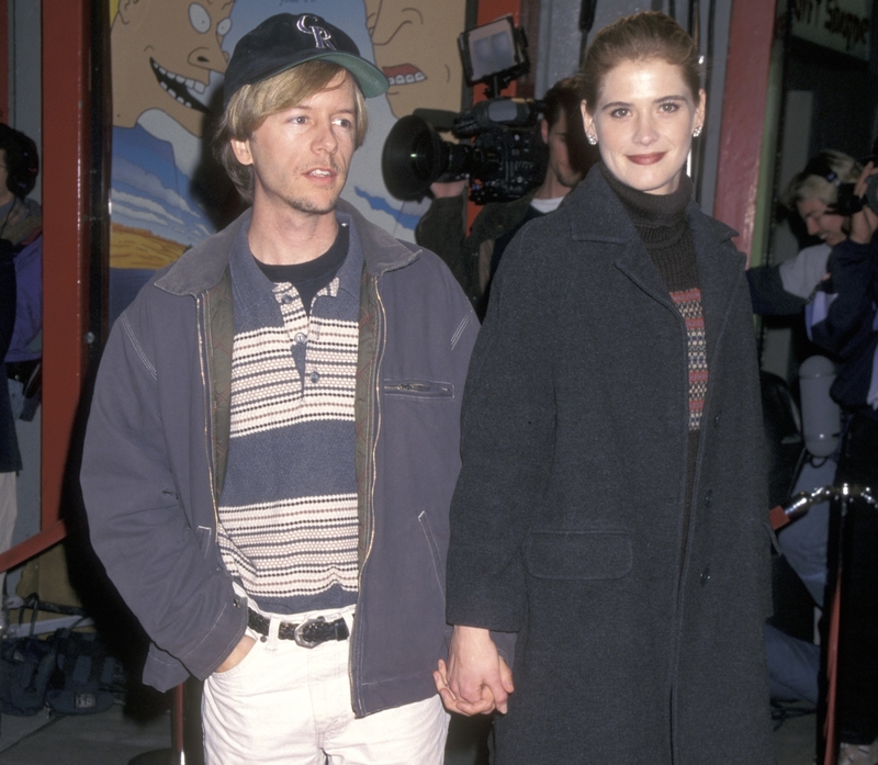 David Spade e Kristy Swanson | Getty Images Photo by Ron Galella Collection