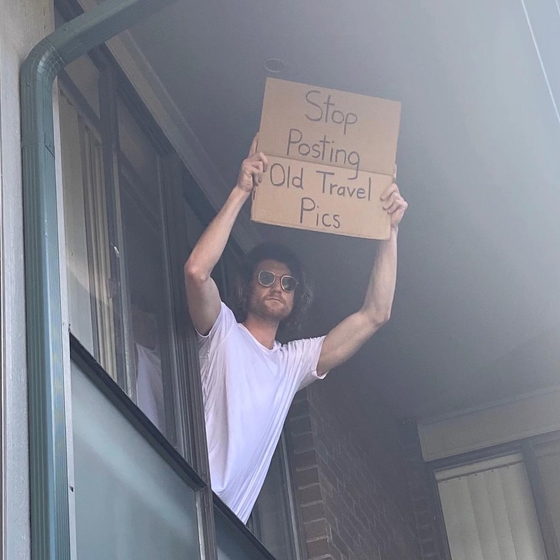 He Says, From the Small Window of His Apartment | Instagram/@dudewithsign